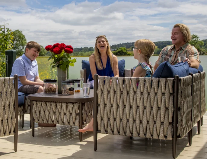 A family enjoying the outdoors on their caravan decking